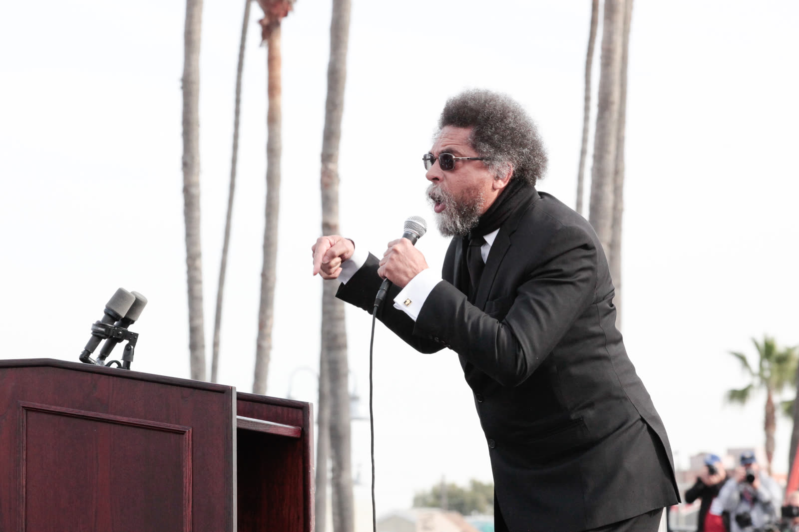 Dr. West at the microphone